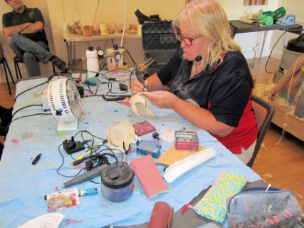 Piercing and carving with a high speed air drill and dental burrs